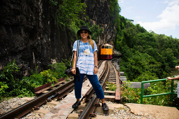 Asian travelers thai women travel visit and posing portrait on track train for take photo and view...