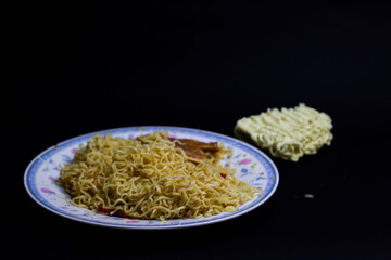 A classic Indonesian instant noodle meal, perfect for budget-friendly student life. Quick, delicious, and a dormitory staple. Isolated black background