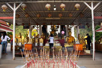 Buddha statue of Wat Khao Sung Chaem Fa temple on Khao Sam Sip Hap mountain for thai people and...