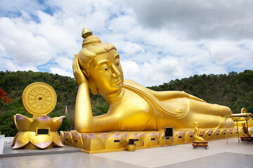 Buddha reclining attitude statue of Wat Khao Sung Chaem Fa temple on Khao Sam Sip Hap mountain for...