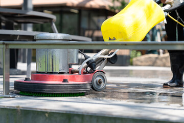 cleaning floor with machine