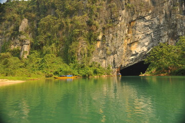 Tourist boats near main access of Phong Nha Cave in Vietnam. 