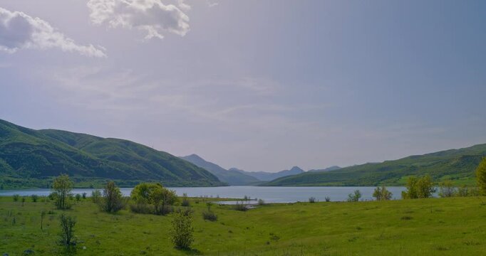 a lush green plain and mountains with a beautiful lake in the middle. Murat river, Bingol, Genc, Camliyurt, Hodan