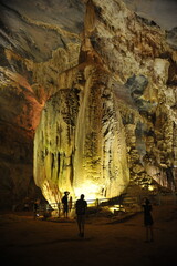 Tourists watching fasncinating nature interior of  Phong Nha Cave in Phong Nha Ke Bang National Park, Vietnam.