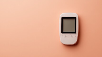 Side angle of glucose monitor on cream surface with copy space around