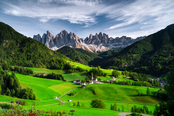 Picturesque valley in spring with beautiful mountain peaks against the background of a historic...