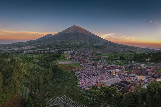 Thousands gather for Eid al-Adha prayer at Garung Field with Mount Sindoro as backdrop, Wonosobo, Central Java, June 6, 2025