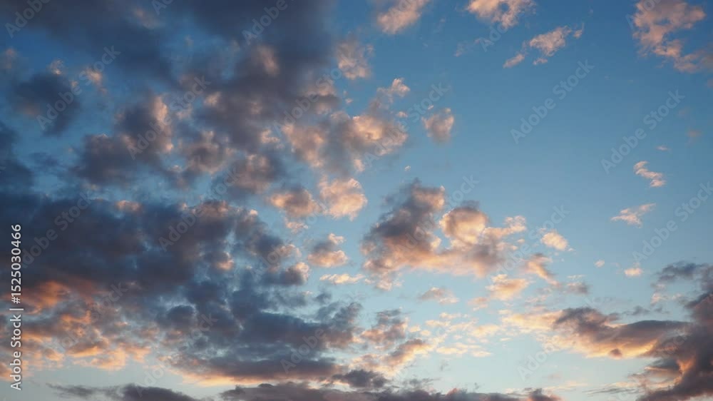 Poster Evening sky transforms with breathtaking clouds shifting colors as the sun sets. This enchanting video footage reveals the dynamic beauty of twilight and changing light