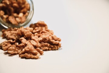 Organic Peeled Walnuts on White Table.