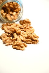 Organic Peeled Walnuts on White Table.