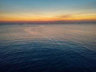 Landscape view of a calm sea in the late afternoon with soft natural light. Tranquil and peaceful coastal scenery.