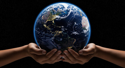 Human hands holding glowing Earth at night, continents lit by cities, starry space. Concept for Earth Day, energy saving, environment, global conservation, future protection, hope.