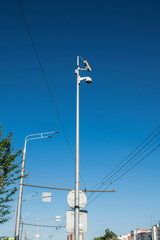 Video camera on a pole in the city