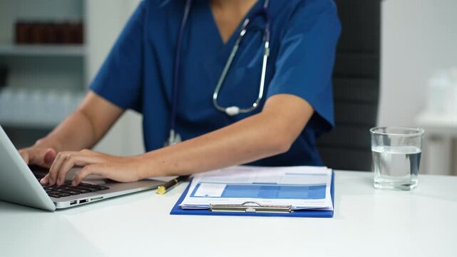Medical students working with tablets and hospital documents.