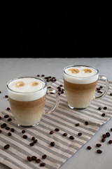 Homemade Latte Macchiato in Glasses, side view.