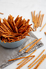 Organic Salty Pretzel Sticks in a Bowl, side view.