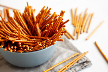 Organic Salty Pretzel Sticks in a Bowl, side view.
