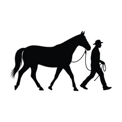 Silhouette of a Cowboy Leading a Horse