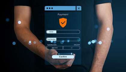 Secure online payment form interface on smartphone held by person with abstract digital light...
