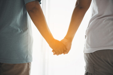 Hope and trust with crisis concept. Closeup, love and holding hands for support, comfort and care with grief, loss and empathy. people and family with compassion, sympathy and healing with bonding.