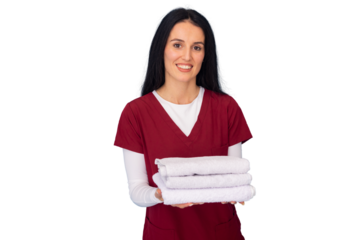 Smiling masseuse holding fresh white towels against a transparent background, embodying the essence of spa and beauty wellness