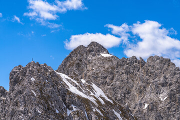 Close view of Seegrubenspitze peak from top of Hafelekarspitze on a sunny day in Spring with blue sky, Innsbruck, Tyrol, Austria