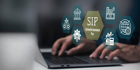 A business person using laptop with SIP Systematic Investment Plan concept.