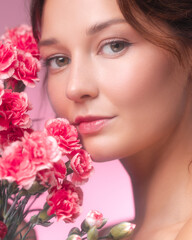 Soft Feminine Portrait With Pink Carnations And Natural Makeup Look