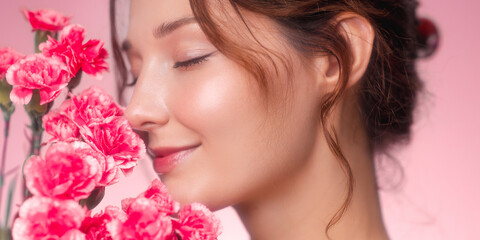 Naklejka premium Girl s Portrait with Pink Flowers and Soft Radiant Glow