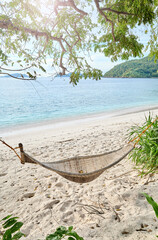 Hammock on the beach of a tropical island, Philippines.