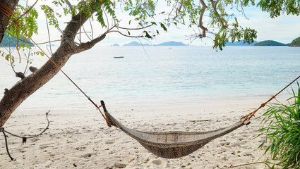 Hammock on the beach of a tropical island, Philippines.