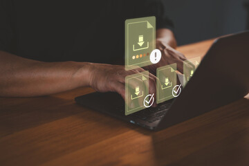 Person using a laptop computer with multiple digital download icons, representing data transfer, cloud storage, file management, digital technology and progress notification system.