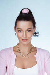 Confident Woman With Elegant Style And Glowing Skin In Studio Portrait