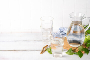 Birch sap in jar and glass