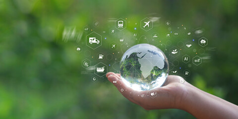 Crystal globe in hand, global transportation concept, net zero logistics, green energy, sustainable development and green global transportation.