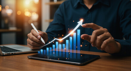 Businessman analyzing growth data on digital tablet with stylus. Concept of financial success, increasing profits, and modern business strategy with glowing bar chart and upward arrow