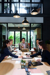 Business Meeting Collaboration Teamwork in Modern Office Asian Professionals Discussing Strategy Data Analysis Brainstorming Solutions Achieving Goals