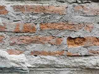 Old Brick Wall Texture with Rough Cement Mortar Background