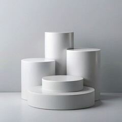 Abstract minimalist white cylindrical display platforms on grey background