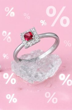 High-resolution cinematic video of a white gold ring with a central ruby gemstone and surrounding diamonds slowly emerging from a block of melting ice. Set against a vibrant pink background with perce