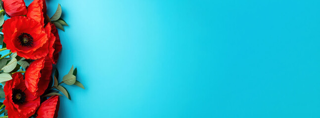 Red remembrance poppies on left side of blue background, floral tribute layout, banner, memorial design element, symbolic composition for Veterans Day, copy space 