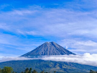 Fototapeta premium Scenic View of Mount Semeru with Rising Smoke in morning. 