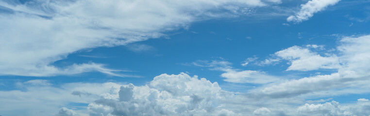 sky is blue with a few clouds scattered throughout