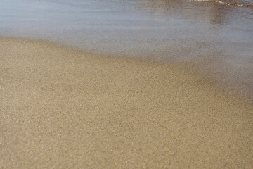 Wet sand on the beach