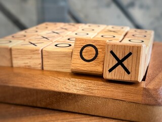 Closed up O X wooden blocks , Tic Tac Toe game. 