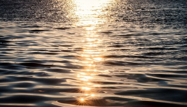 abstract image of a water surface featuring gentle ripples and shimmering light reflections creating a serene texture