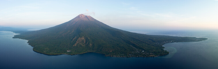 Daybreak illuminates the peak of Iliape volcano on Lembata Island in the Lesser Sunda Islands of Indonesia. This scenic volcano has been extremely active since 2024. © ead72