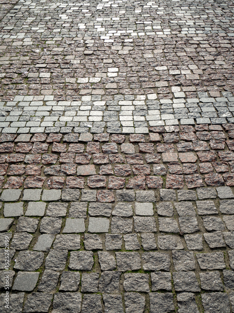 Poster ancient granite pavement. abstract vertical stone geometric background in perspective. copy space.