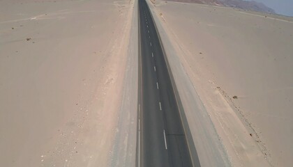 Long desert asphalt road
