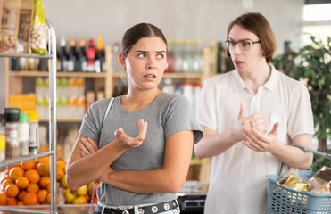 Married couple quarrels in a store and sorts things out. Wife is offended by her husband and...